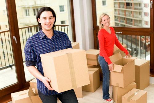 Professional movers loading a van for a Stockwell home move